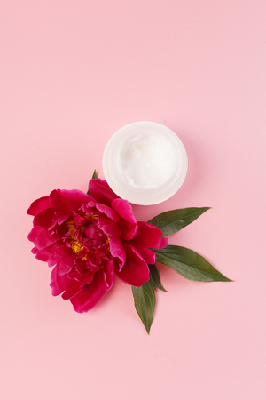cosmetic creams with pink flowersの写真素材
