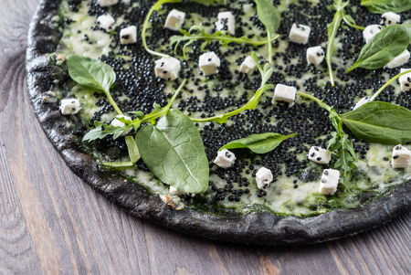 pizza with black caviarの写真素材