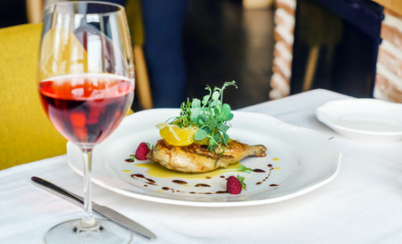 chicken leg with orange fillet and rose wineの写真素材