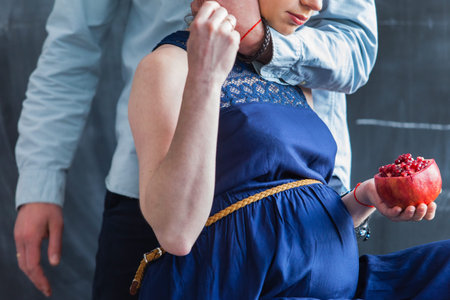Man embraces his pregnant woman