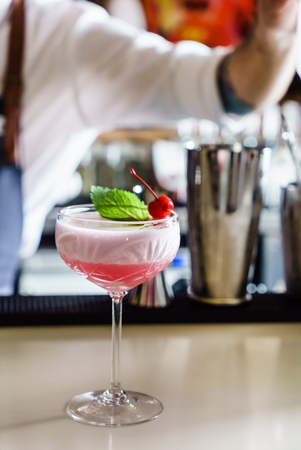 barman making cocktail in the barの写真素材