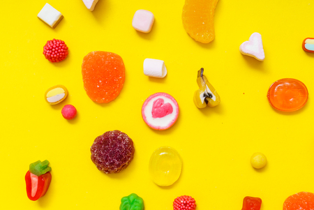 colorful candy on the yellow backgroundの写真素材