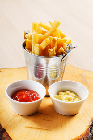 french fries with ketchup and mustardの写真素材