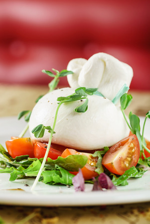 burrata, fresh italian cheese made from mozzarella and creamの写真素材