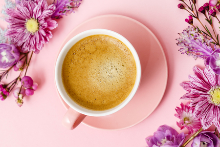 coffee in pink pastel table top viewの写真素材