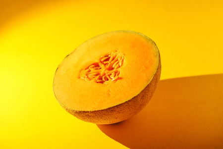 Cantaloupe on yellow background