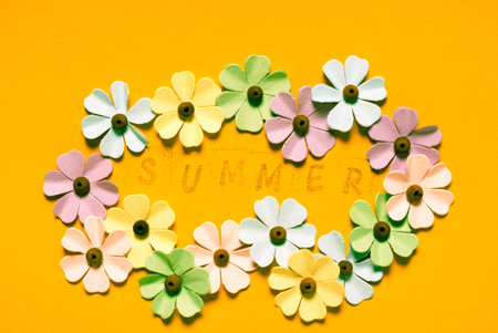 paper flowers on yellow background