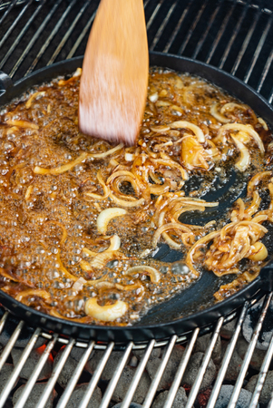 chef frying onionの写真素材