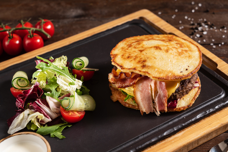 burger from potato pancakes and baconの写真素材