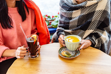 woman drinking mulled wineの写真素材