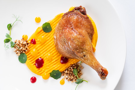 chicken leg with pumpkin pureeの写真素材