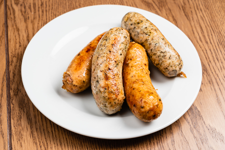 sausages on the white plateの写真素材