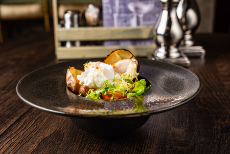 roasted potato with poached eggの写真素材