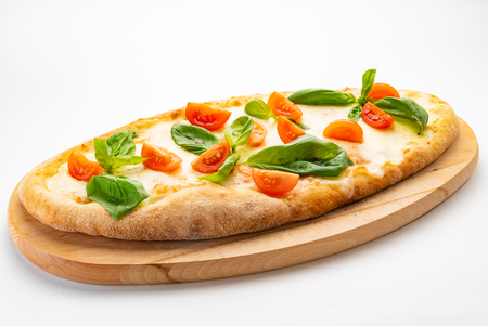 pizza with cherry tomatoes and basilの写真素材