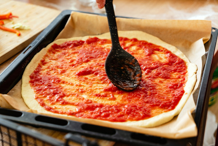 Chef making a pizzaの写真素材