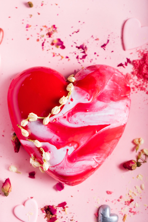 Cake with berries in the shape of heart on Valentine's Dayの写真素材