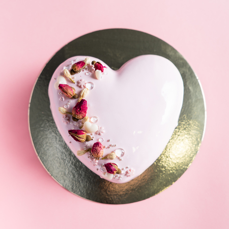 Cake with berries in the shape of heart on Valentine's Dayの写真素材