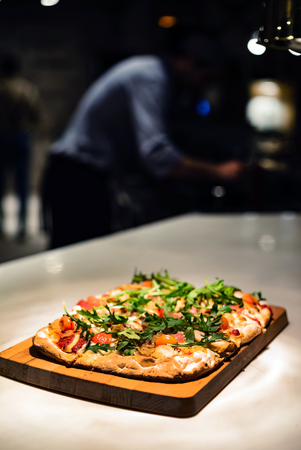 Pizza in the pizzeriaの写真素材