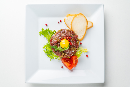 French cuisine, beef steak tartare with raw quail egg yolkの写真素材