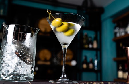 martini cocktail with olivesの写真素材