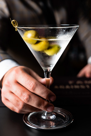 martini cocktail with olivesの写真素材