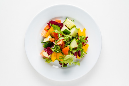 vegetable salad on the white plateの写真素材