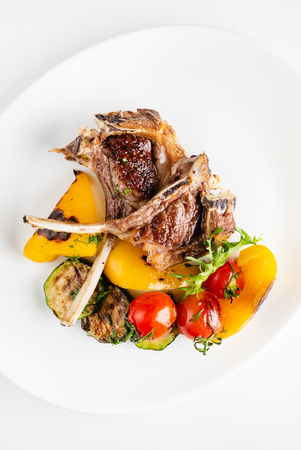 Modern French cuisine: Roasted Lamb neck & rack served with carrot, yellow curry and lamb sauce.の写真素材