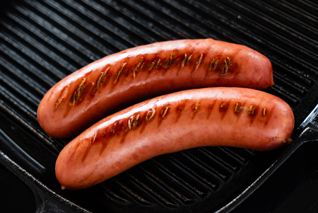 Grilled sausages in frying panの写真素材