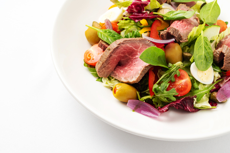 Thai grilled beef salad on the white plateの写真素材
