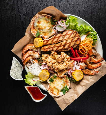 seafood plate on the black backgroundの写真素材