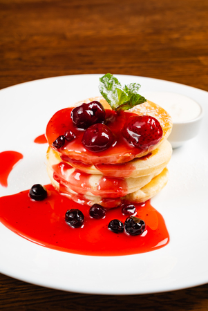 pancakes with berry sauceの写真素材