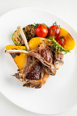 Modern French cuisine: Roasted Lamb neck & rack served with carrot, yellow curry and lamb sauce.の写真素材