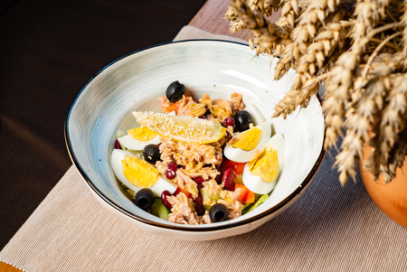 tuna salad with egg and olivesの写真素材