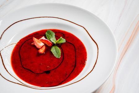 strawberry soup with chocolate sauceの写真素材