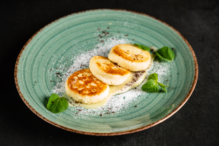 cottage cheese pancakes with sweet sauceの写真素材