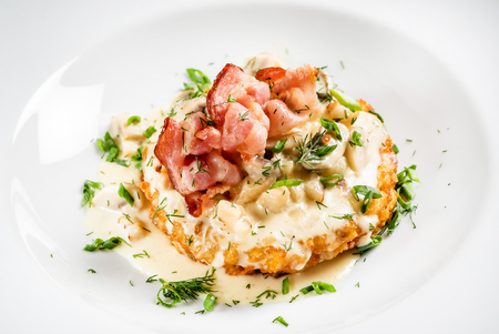 potato pancakes with bacon and sauceの写真素材