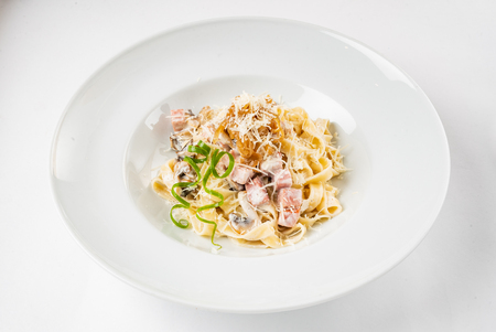 Carbonara pasta, spaghetti with pancetta, egg, hard parmesan cheese and cream sauce.の写真素材