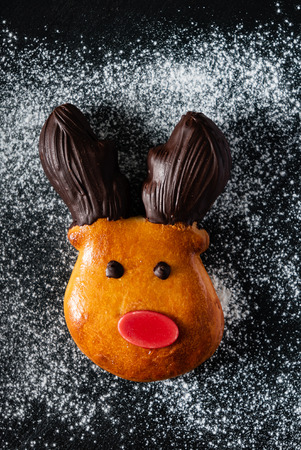 Brioche deer with red nose and chocolate horns, Christmas bakeの写真素材