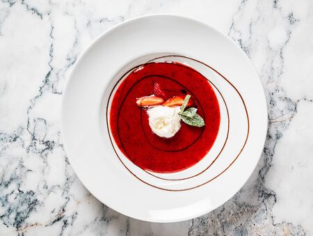 strawberry soup with ice creamの写真素材