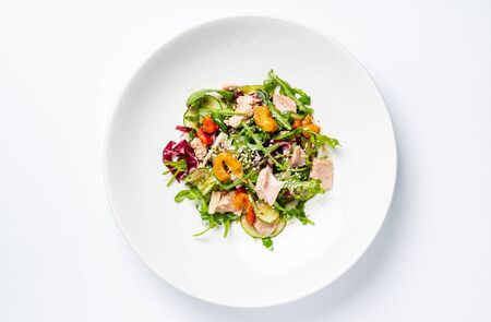 Salad with tuna on the white plateの写真素材