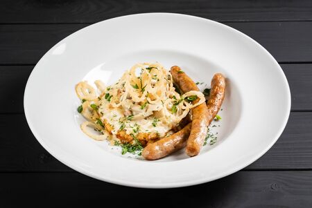 potato pancakes with sausages and fried onionの写真素材