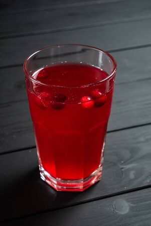 cranberry lemonade on the black wooden backgroundの写真素材