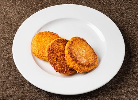 carrot pancakes on the white plateの写真素材