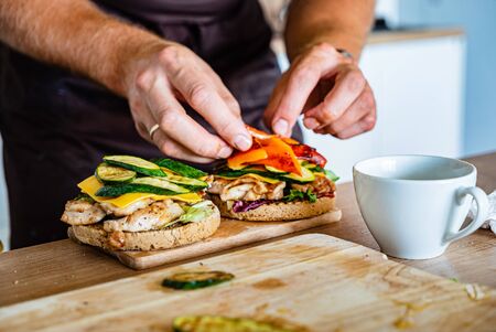 Man making burger on the kitchenの写真素材