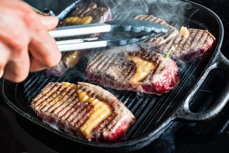 grilled steaks on the panの写真素材