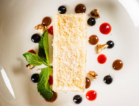 napoleon cake wiht berry sauceの写真素材