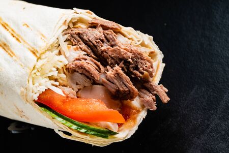 fajita wrap sandwich on the black backgroundの写真素材