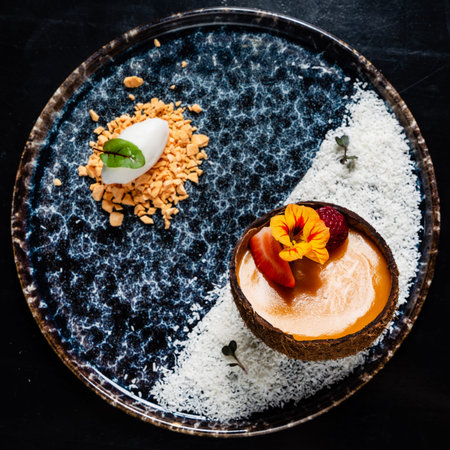 coconut dessert with mango and berriesの写真素材