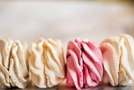 Beautiful delicious dessert. Zephyr in the shape of flowers roses.の写真素材