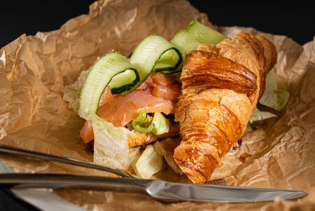 croissant with salted salmon and cucumberの写真素材